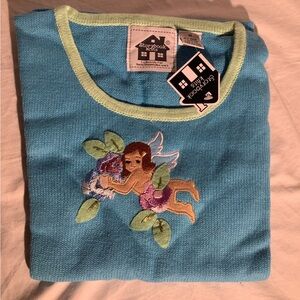 Storybook knit tank titled “Cherub’s Garden”